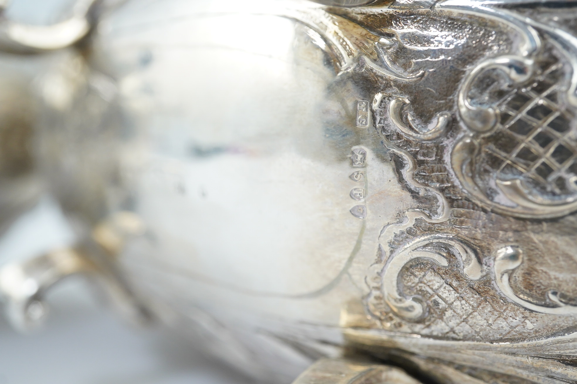 A pair of late 19th century German Hanau ornate embossed silver oval sweetmeat bowls